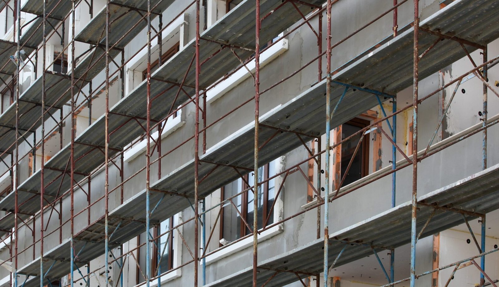 A beautiful shot of metal steel bars and glass windows in the building